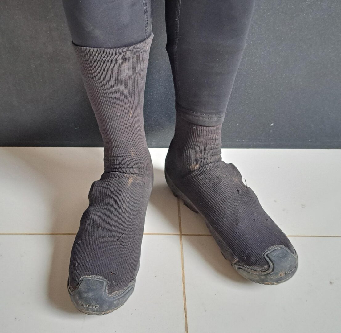 Waterproof legwarmers worn over Explorer Waterproof Gravel Shoe Covers help keep the water out